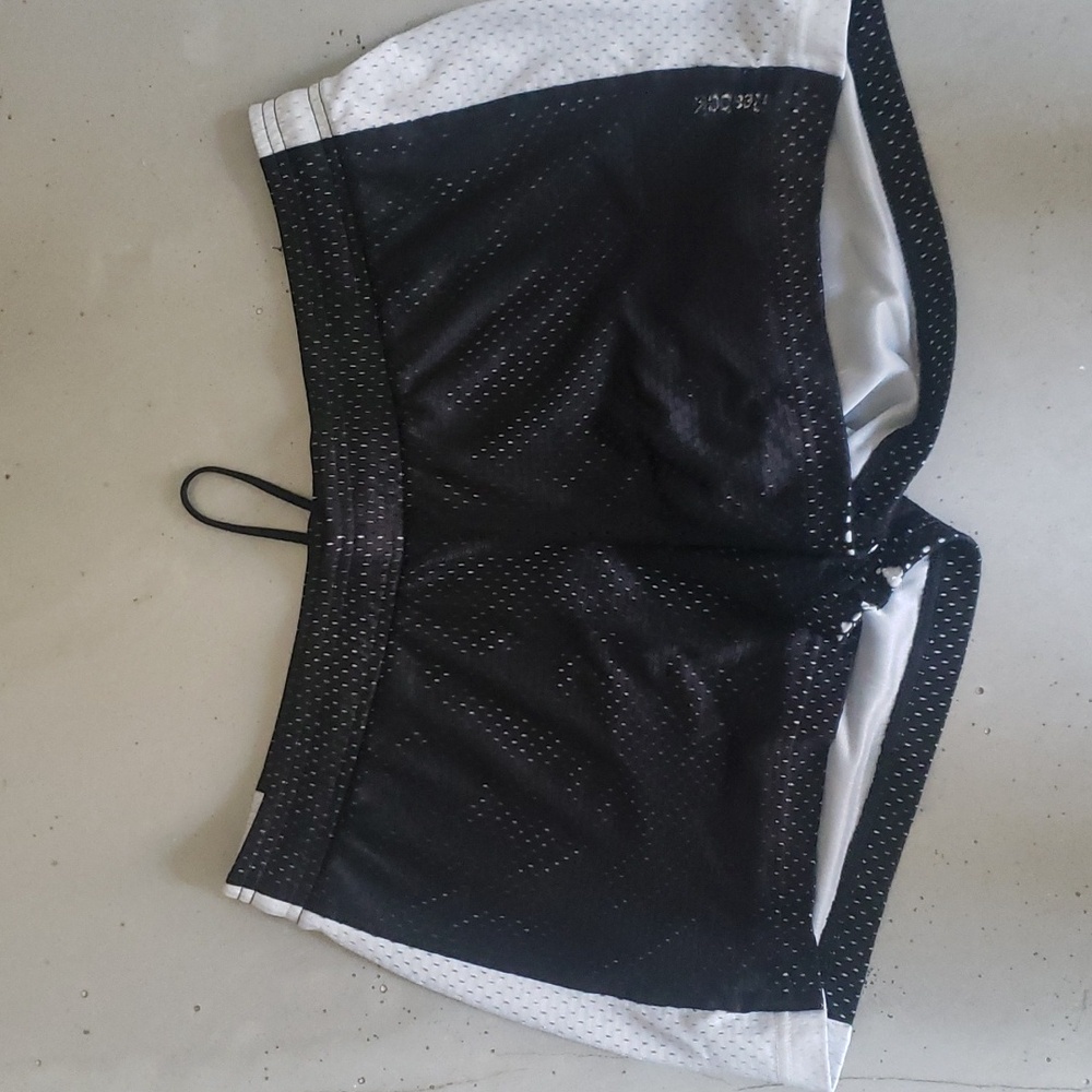 Reebok mesh athletic shorts, size medium, black and white.